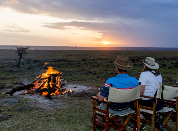 Watch the sun set over the stunning Kenyan landscape with a cool refreshing drink 