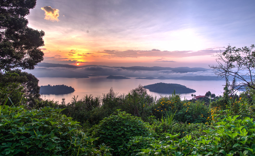 sparkling lakes, lush forests, dramatic volcanoes and rolling plains dotted with game