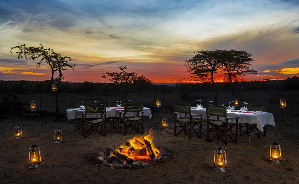Romantic dinner under the stars on safari in the Masai Mara in Kenya